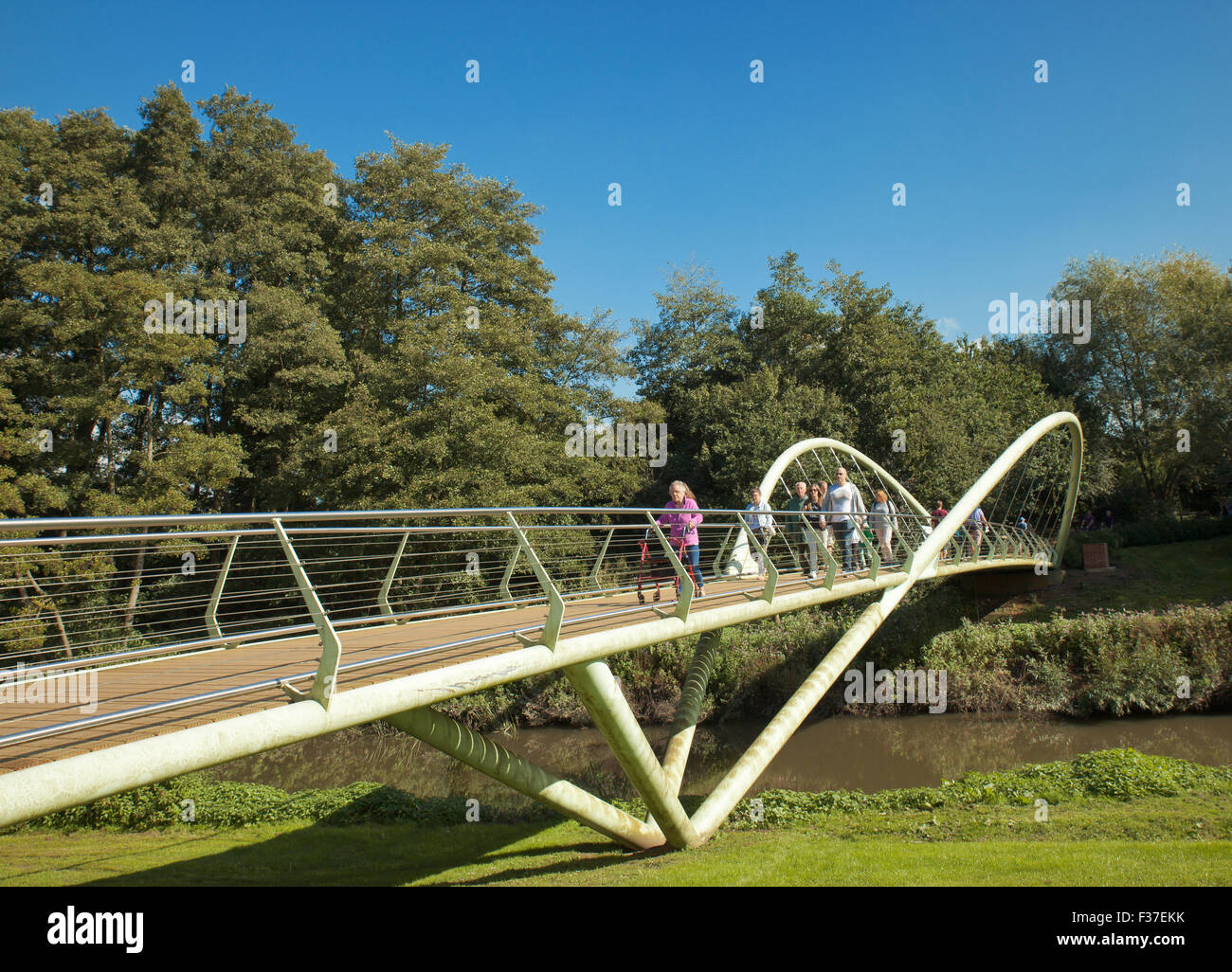 Entrance to Painshill Park Gardens, footbridge crossing the river Mole. Stock Photo