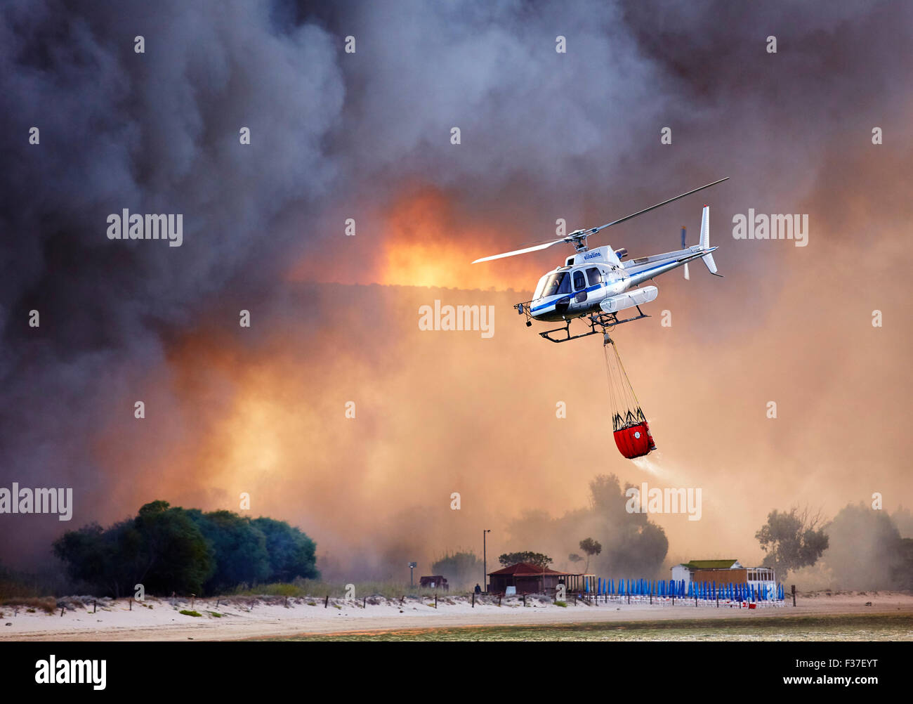 Firefighting Helicopter Dousing Forest Fire Over Sardinia Stock Photo Alamy