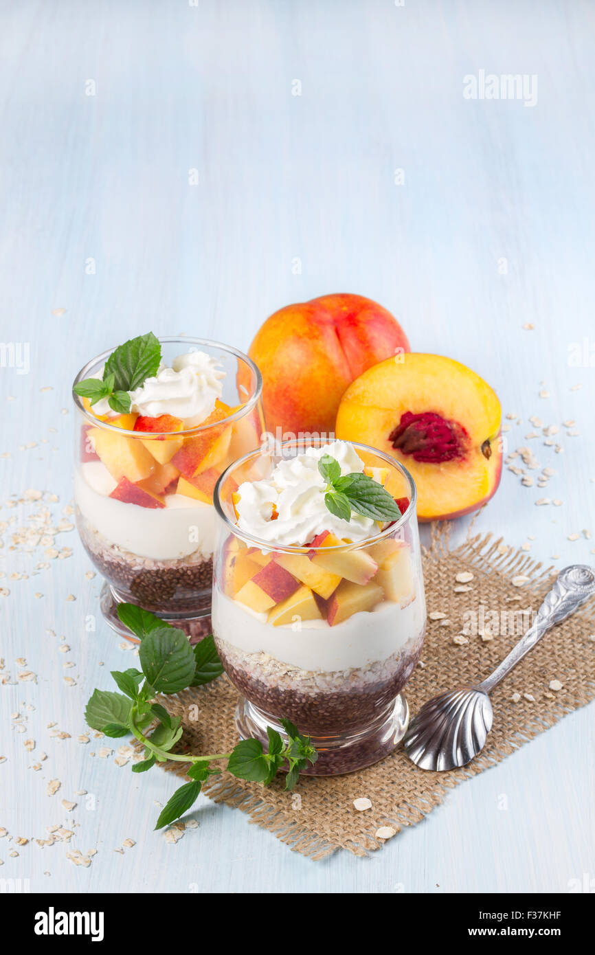 Chia seeds with oat flakes and peaches. Vertical image. Stock Photo