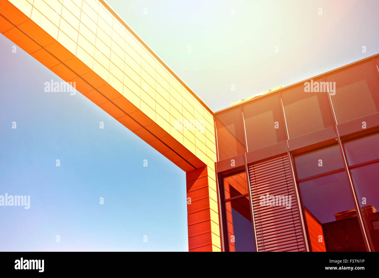 Business architecture. Picture of business office building with blue summer sky and sunlight. Stock Photo