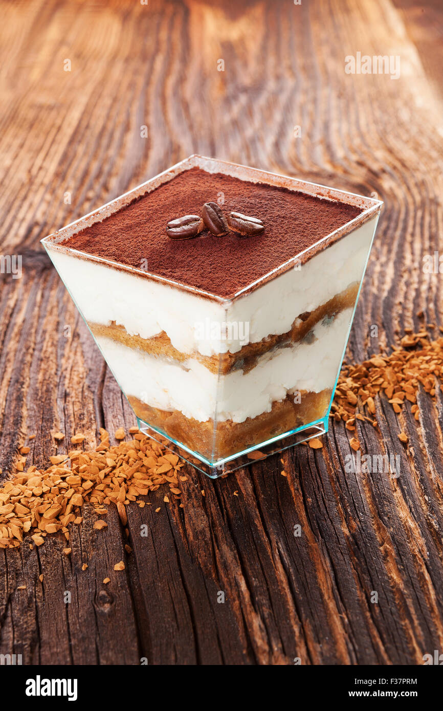 Tiramisu dessert with coffee beans and instant coffee on wooden textured table. Traditional tiramisu dessert rustic Stock Photo Alamy