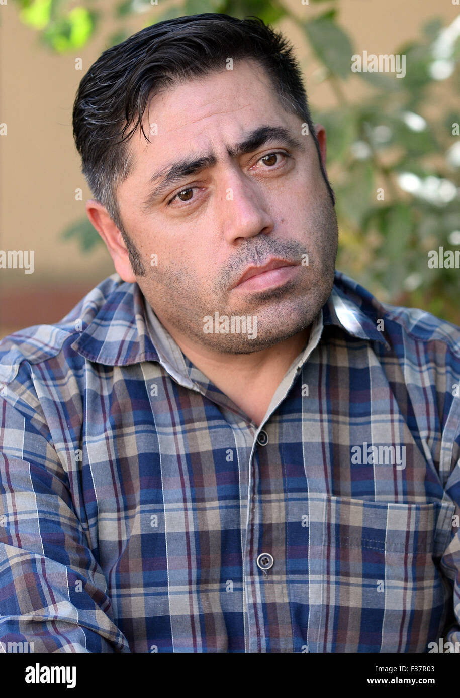 Kabul, Afghanistan. 26th Sep, 2015. Yasin Adel, former translator for the German armed forces Bundeswehr, explains his situation in Kabul, Afghanistan, 26 September 2015. Adel used to work as a translator for the German armed forces until autumn 2006. His application for asylum was rejected by German authorities. Photo: Subel Bhandari/dpa/Alamy Live News Stock Photo