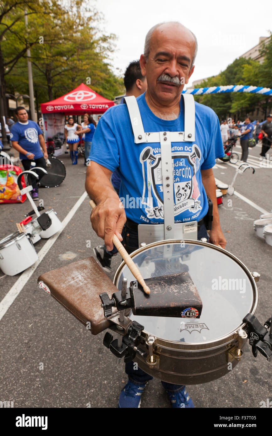 Man playing treble drum and cowbell - USA Stock Photo