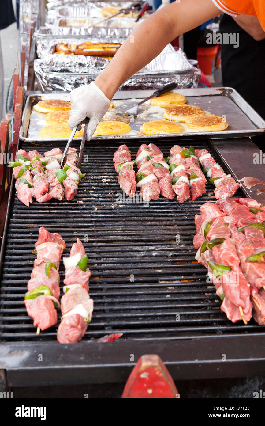 Man grilling barbecue beef skewers USA Stock Photo Alamy
