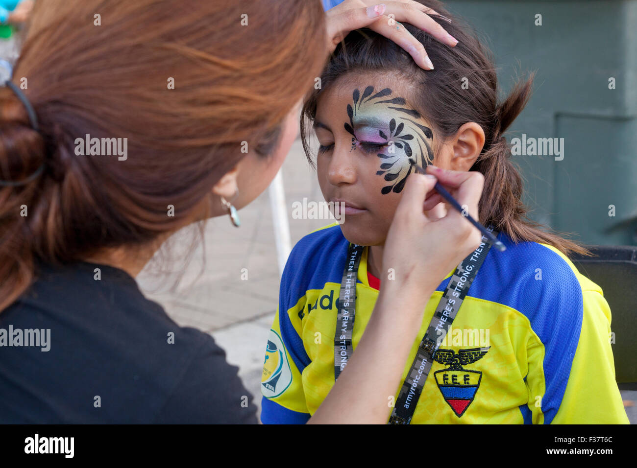 Young girl getting face painting - USA Stock Photo