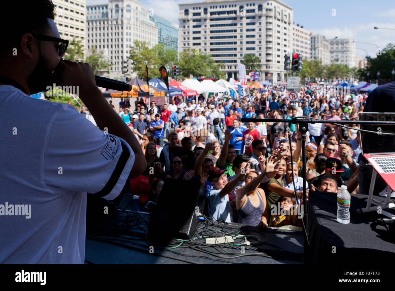 Hip-hop performer on stage at an outdoor concert - USA Stock Photo