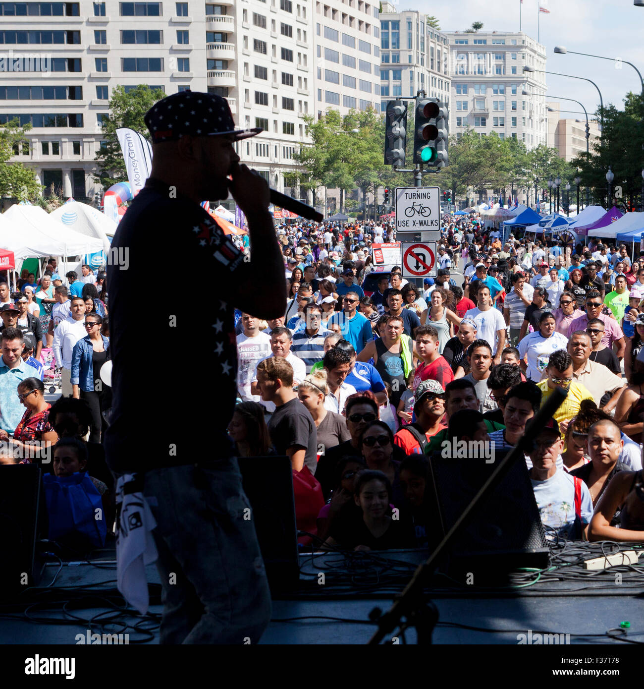 Hip-hop performer on stage at an outdoor concert - USA Stock Photo