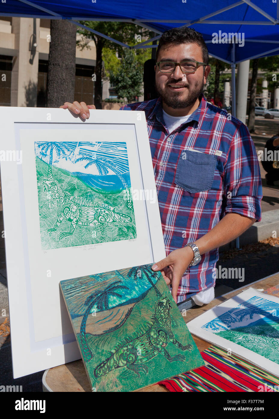 Wood block print artist showing his work - USA Stock Photo