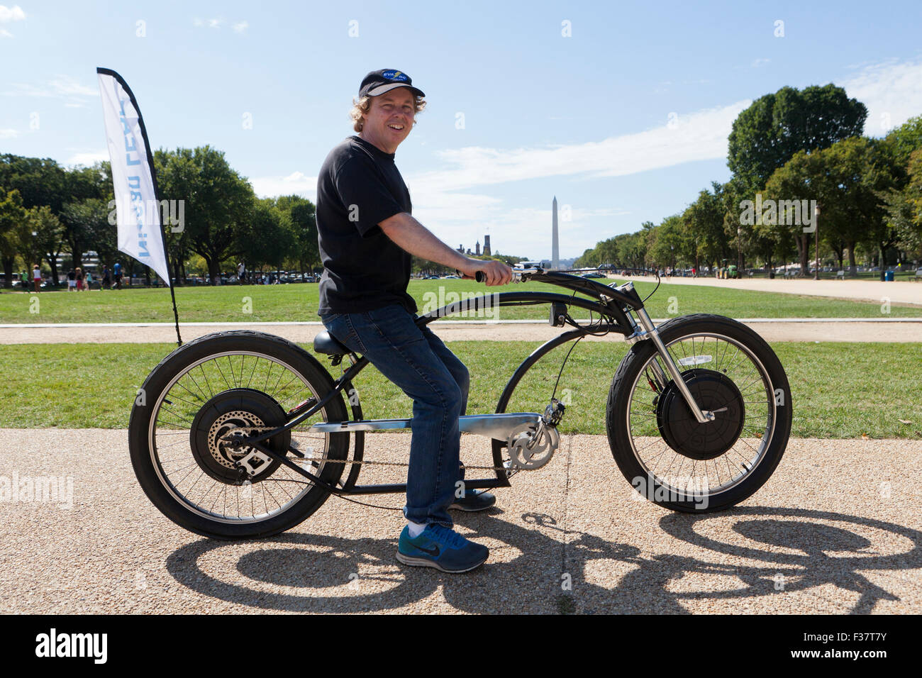 Man riding a handmade electric bicycle - USA Stock Photo