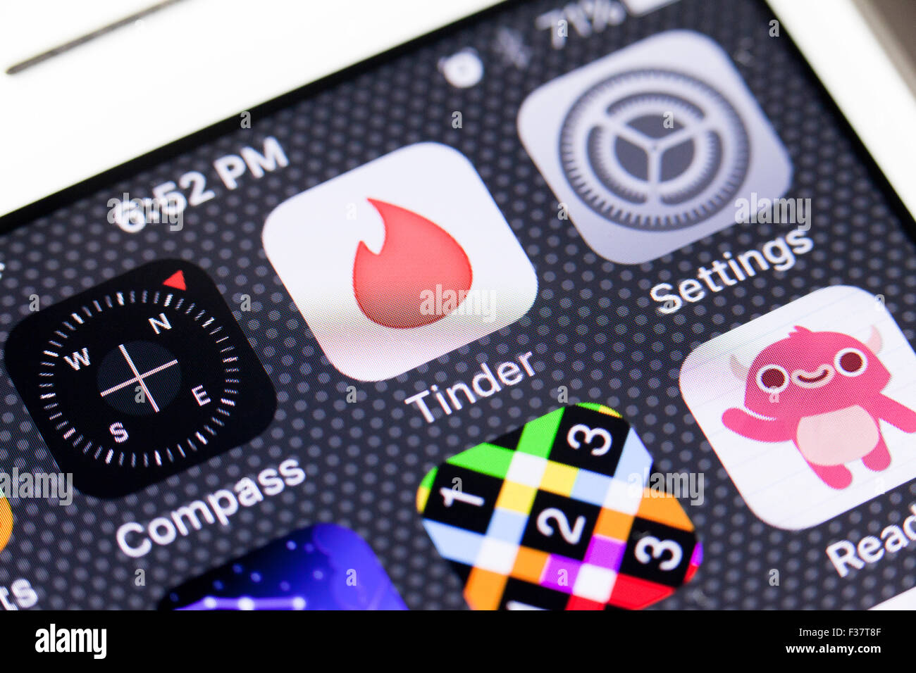 Tinder app icon on iPhone screen - USA Stock Photo