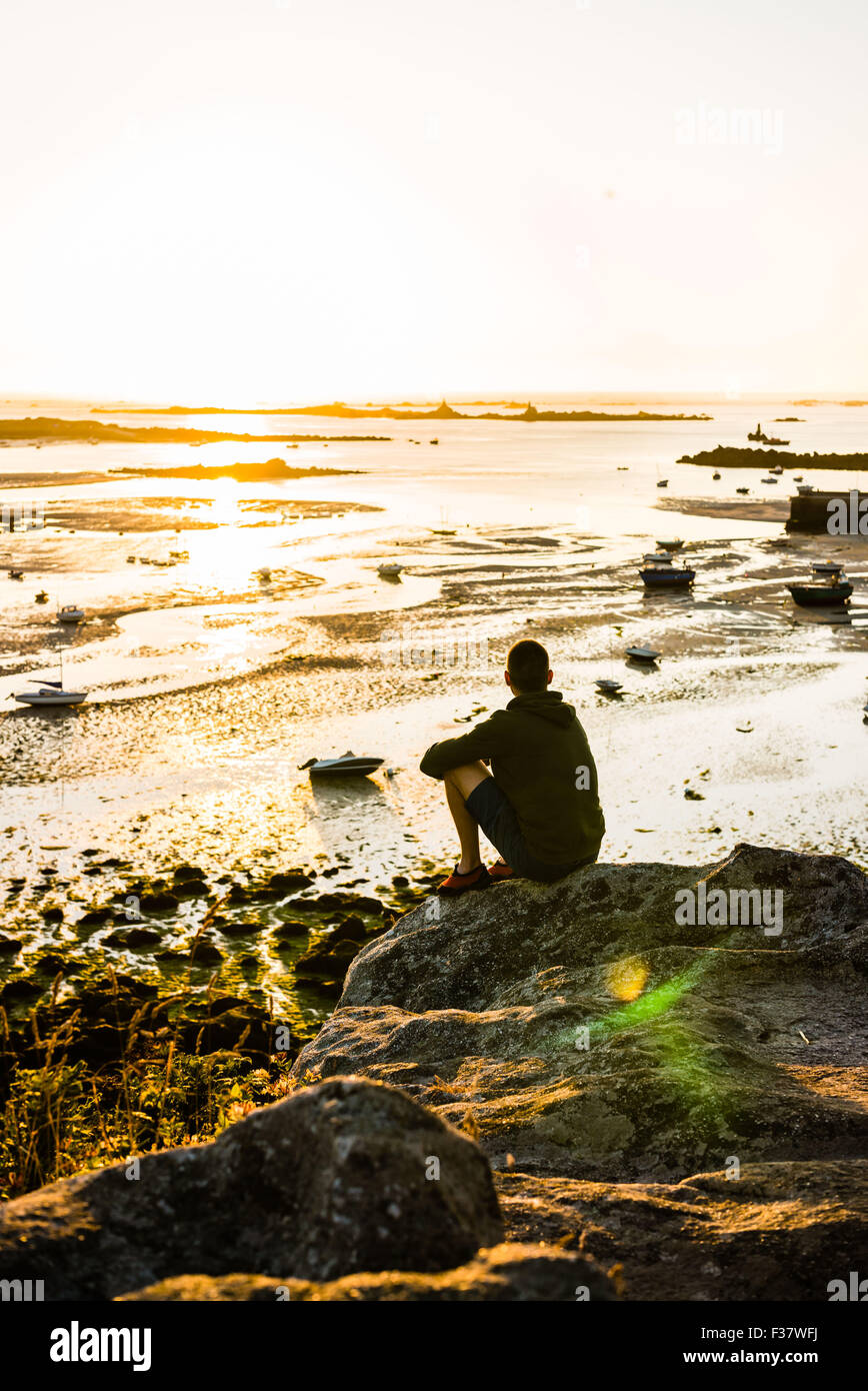 Man watching the sunset , Portsall (Brittany, France Stock Photo - Alamy