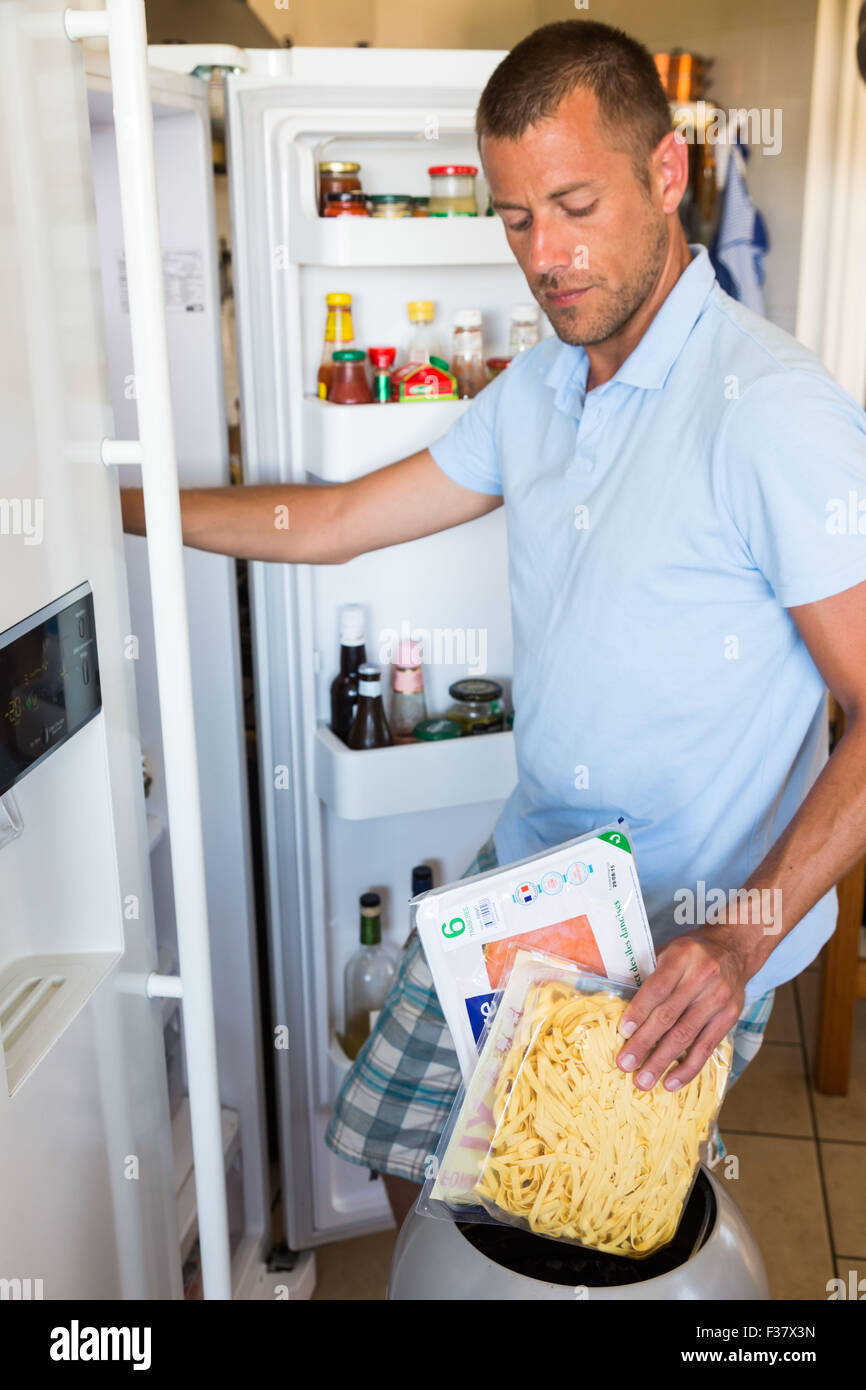 Man checking the composition and nutrition facts. Stock Photo