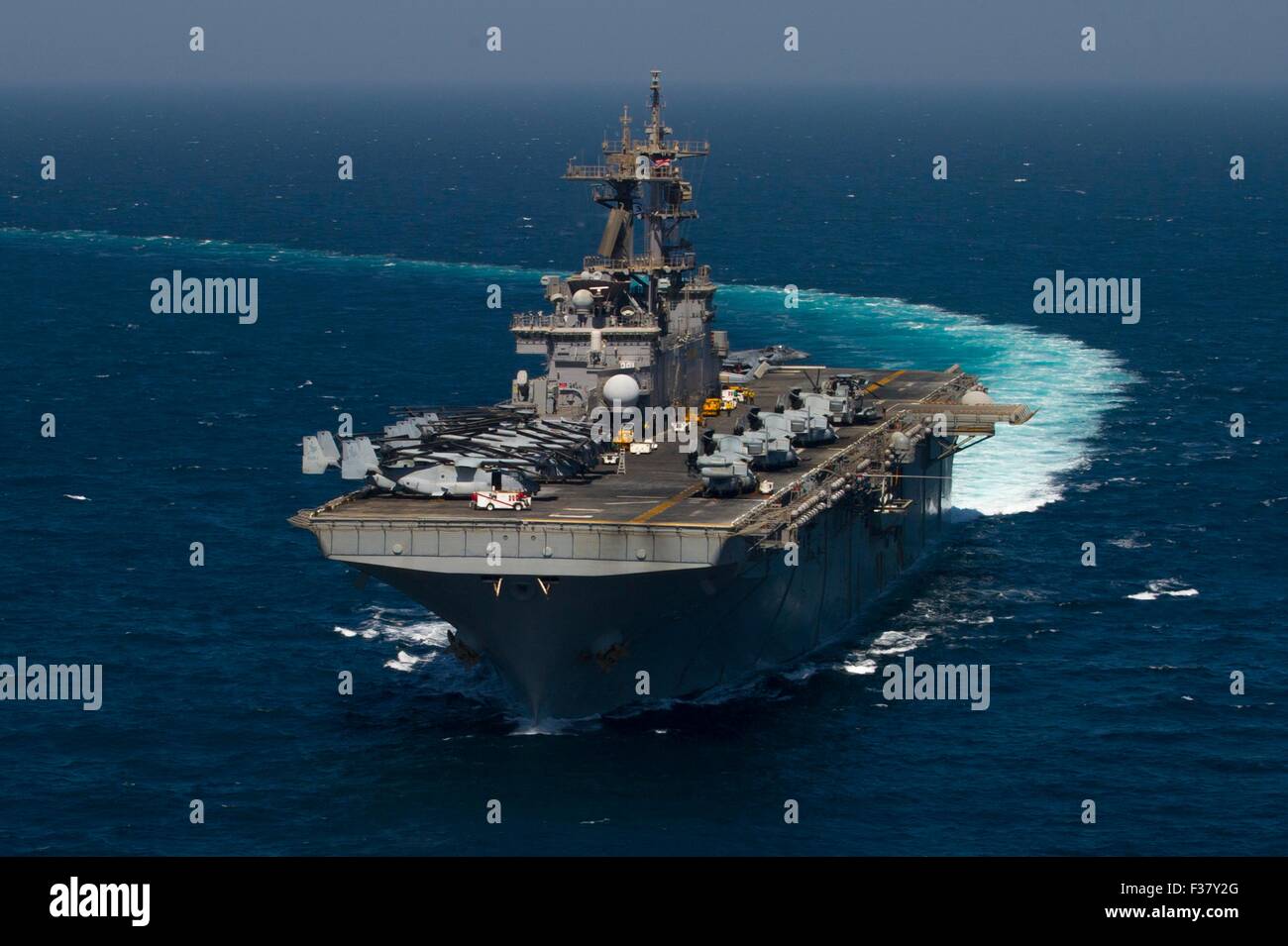 U.S. Navy Wasp-class amphibious assault ship USS Essex underway September 24, 2015 in the Arabian Gulf. Stock Photo