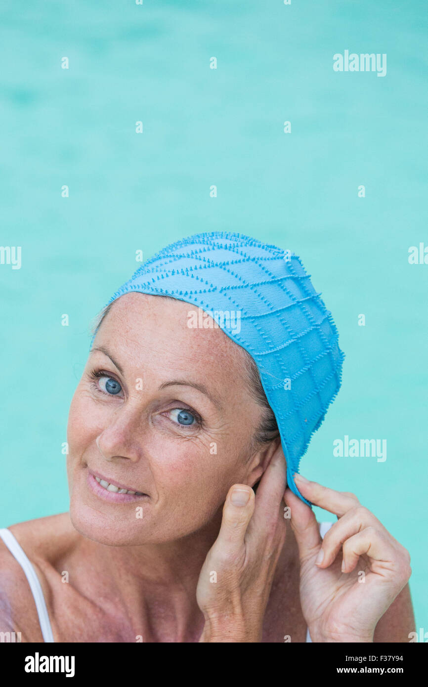 Woman in a pool wearing a bathing cap Stock Photo Alamy
