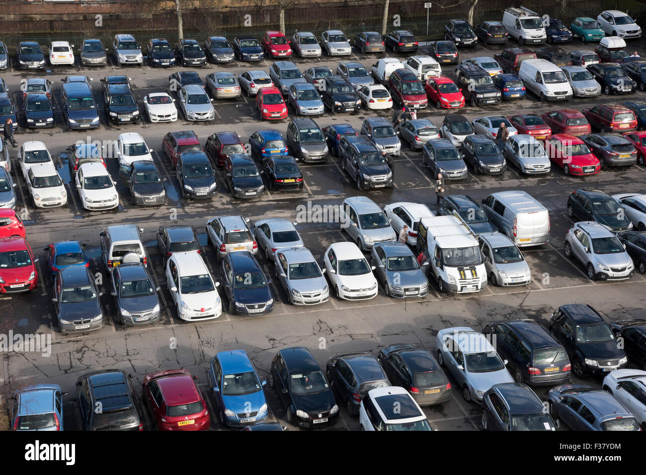 High view from Clifford's Tower - lots of cars (various models & colours) & vans parked in lines, in busy Castle car park, York, North Yorkshire, UK. Stock Photo