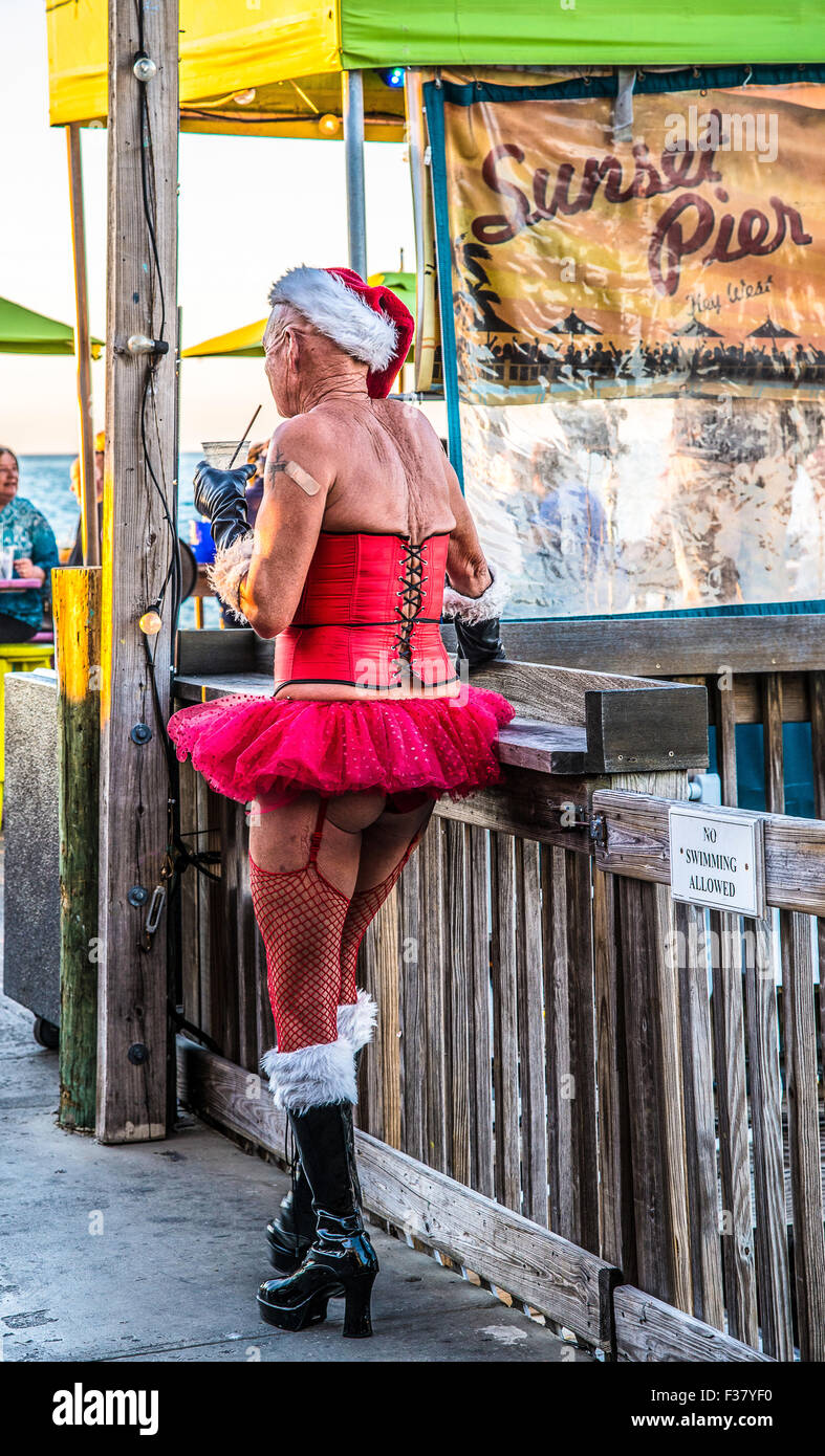 Key west Christmas time on Sunset Pier, Mallory Square. Unconventional Father Christmas Stock Photo