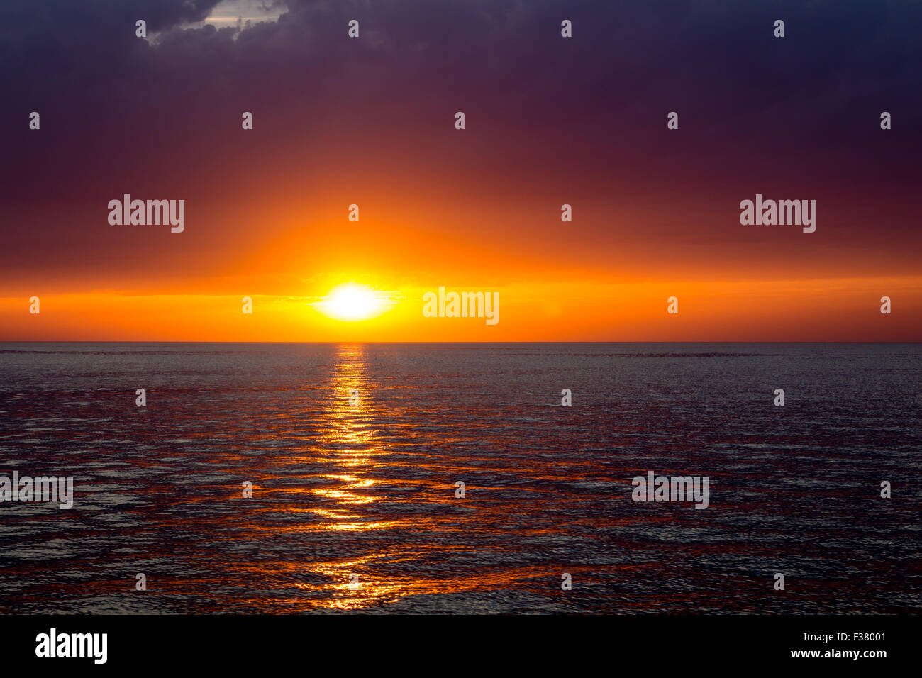 beautiful landscape with sunset over sea with dramatic sky Stock Photo