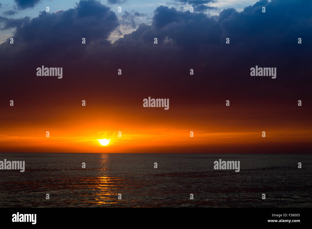 beautiful landscape with sunset over sea with dramatic sky Stock Photo