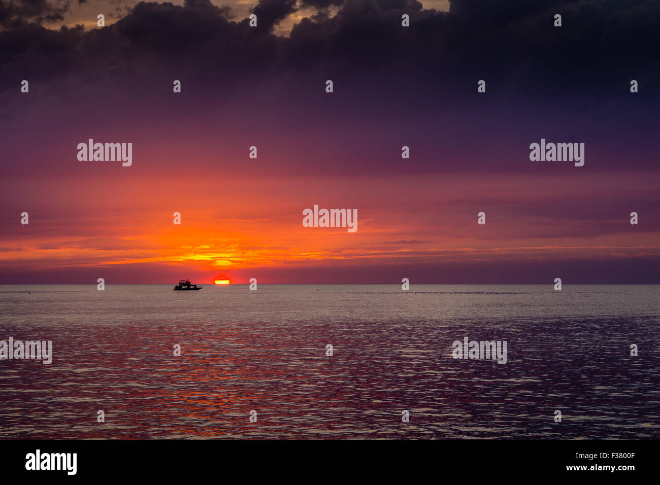 beautiful landscape with sunset over sea with dramatic sky Stock Photo