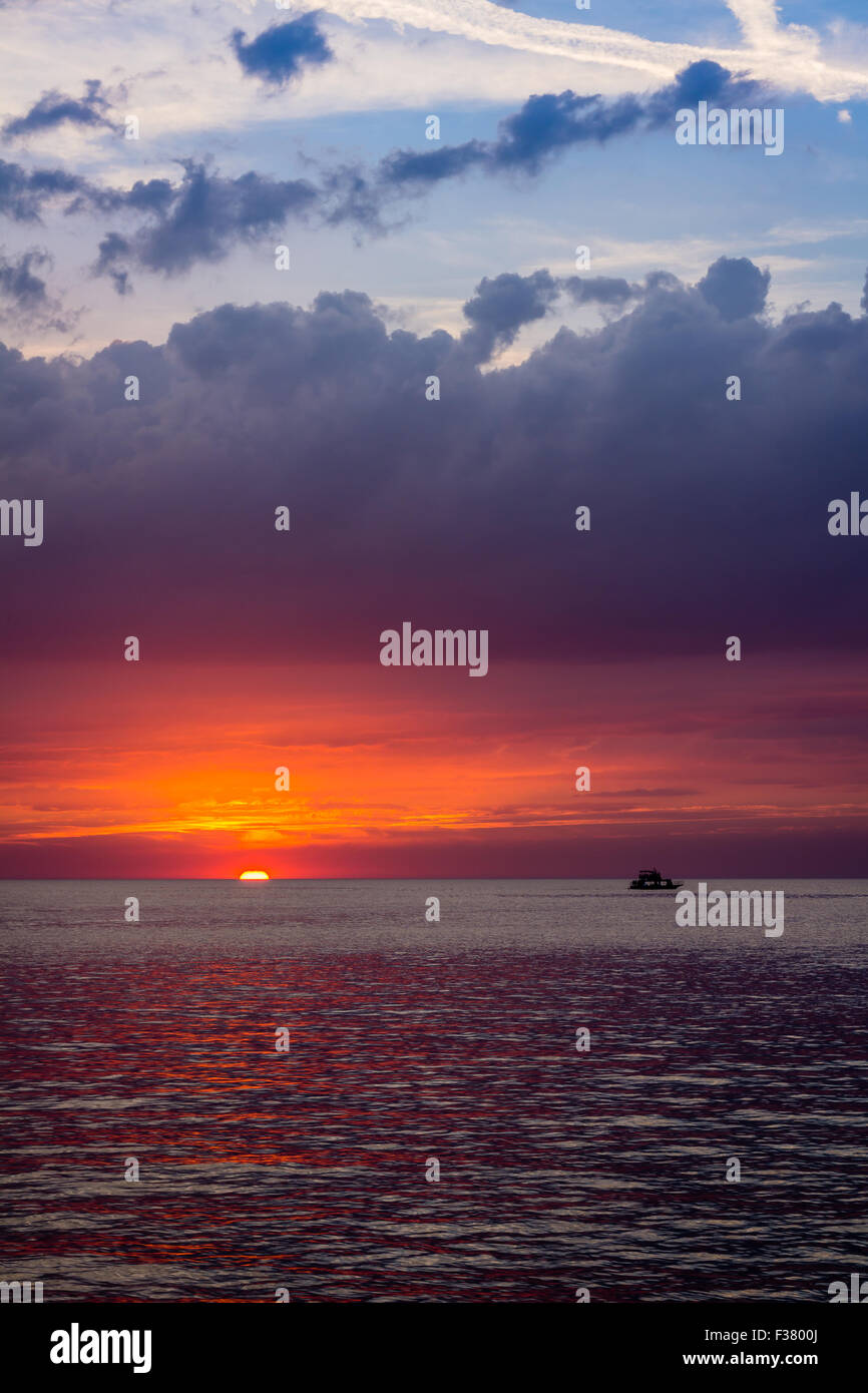 beautiful landscape with sunset over sea with dramatic sky Stock Photo