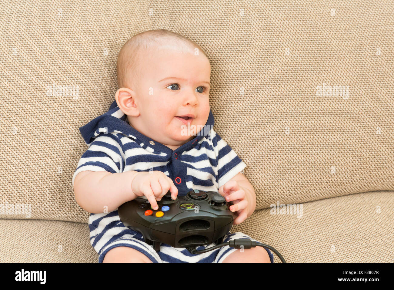 baby playing computer game Stock Photo