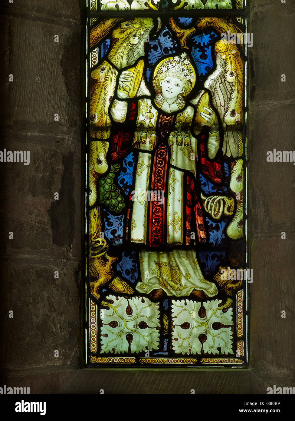 Lichfield Cathedral angel playing cymbals  window Stock Photo