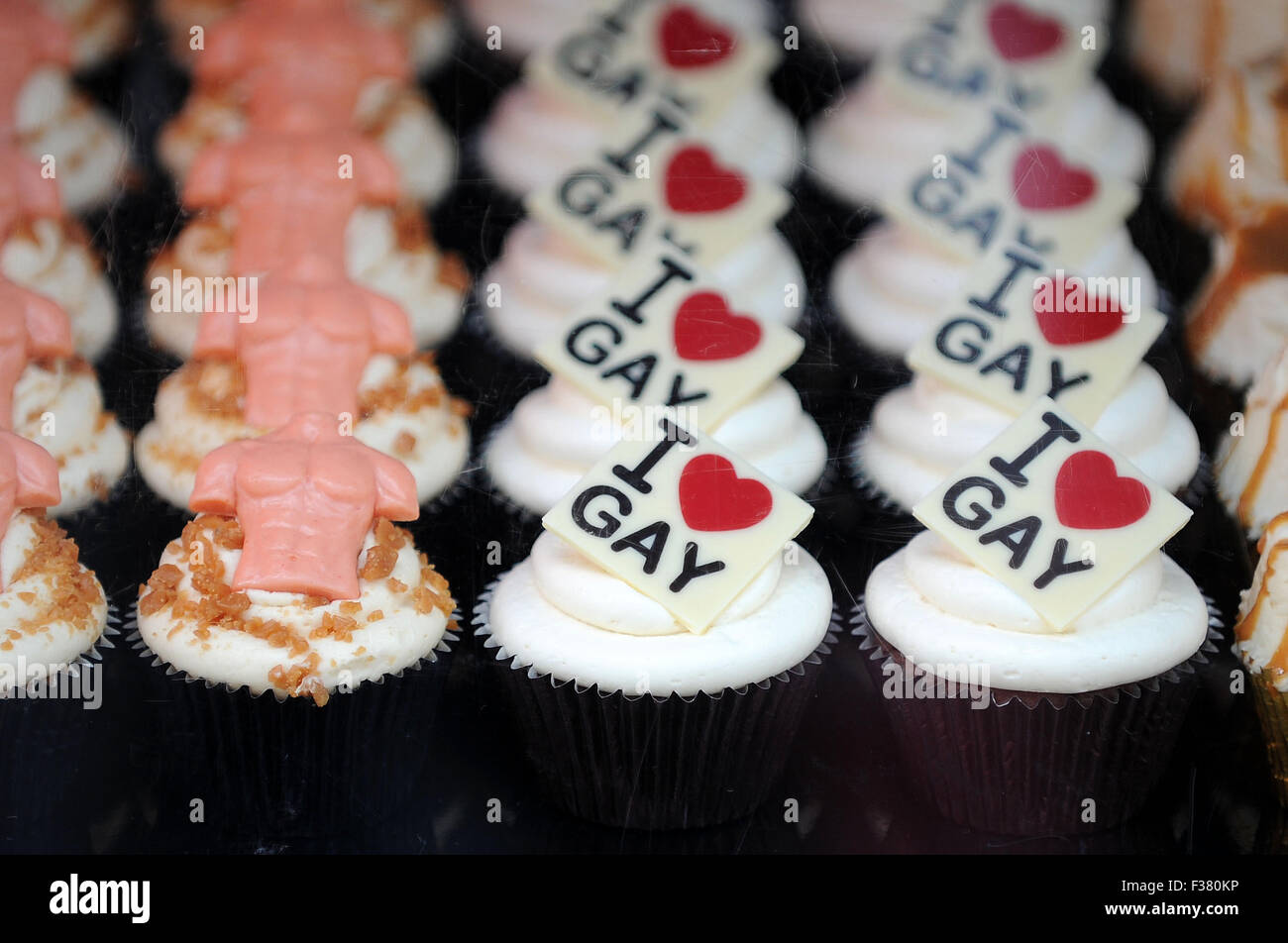 Cupcakes on sale with the words 'I love gay' written on them at a Mardi Gras event. Stock Photo