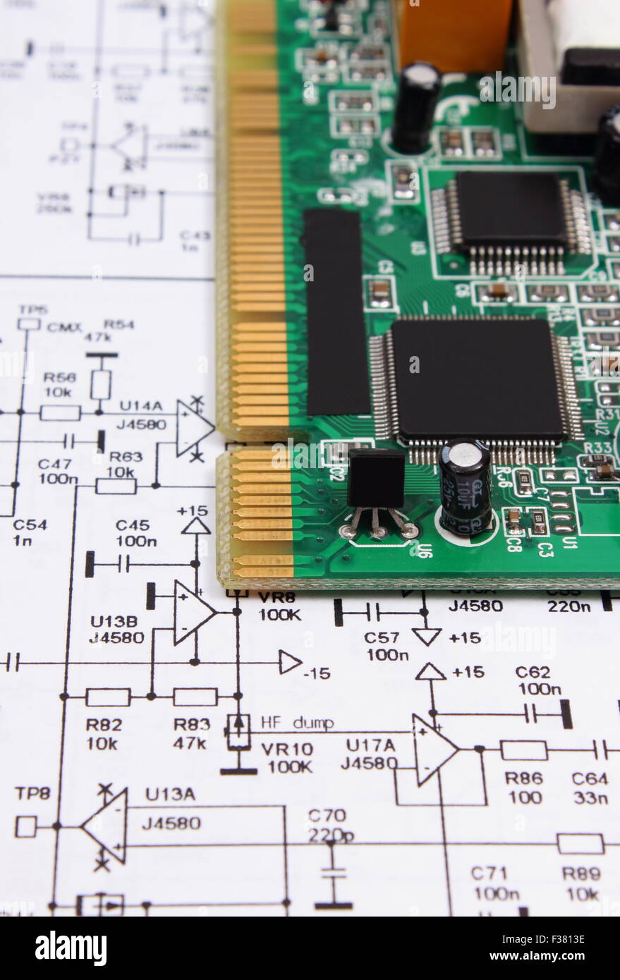 Printed circuit board with electrical components lying on construction ...