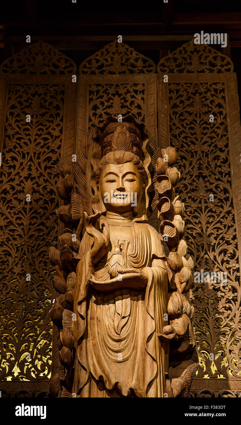 Guan Yin wood carving Stock Photo
