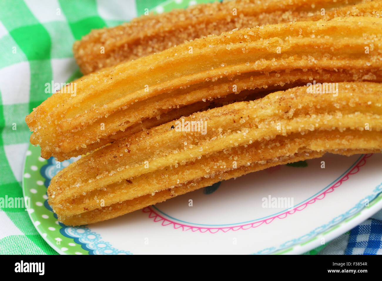 Churros Risers Spanish churros on plate, closeup Stock Photo - Alamy