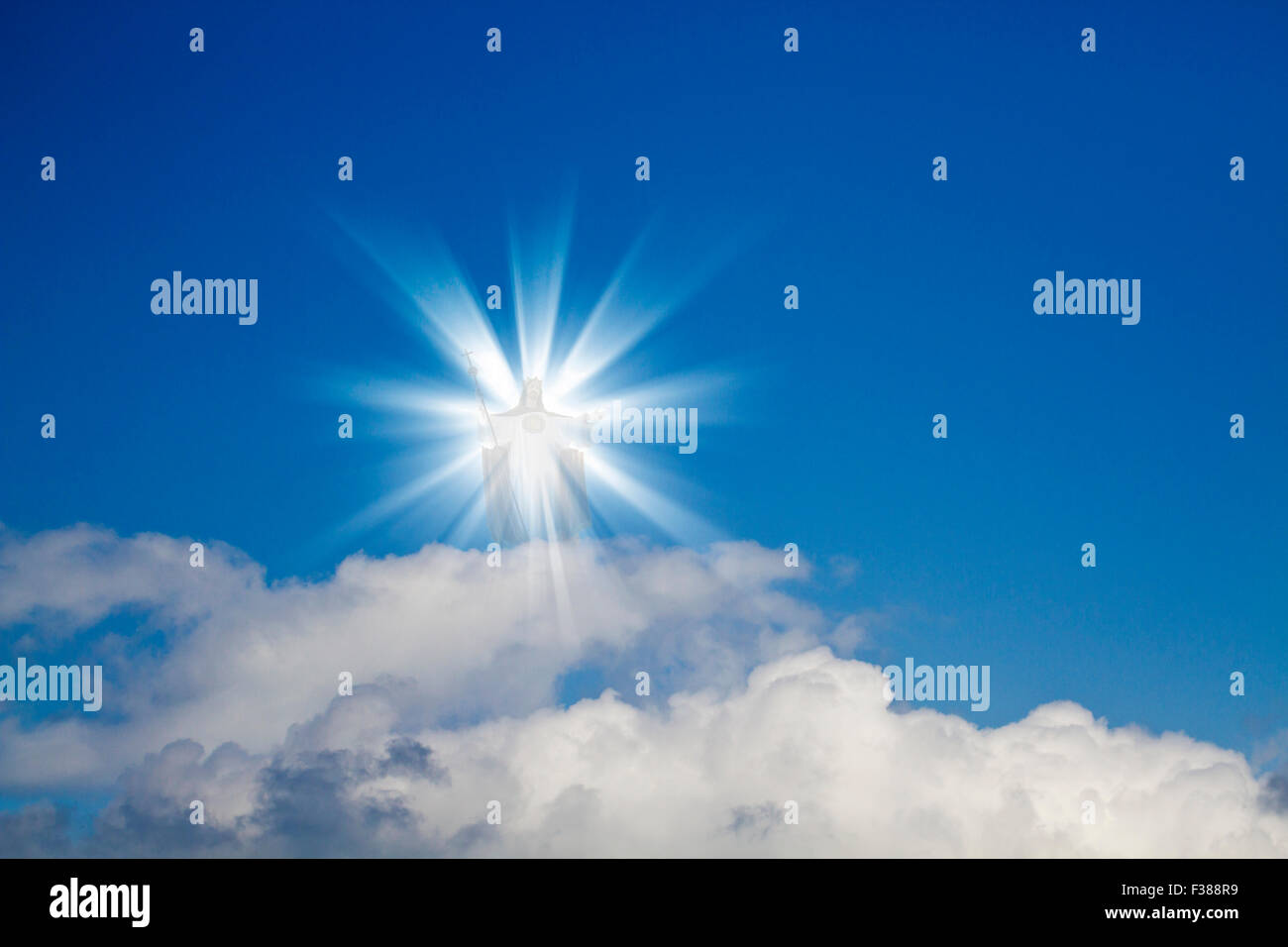 Jesus Christ in blue sky with white clouds - heaven Stock Photo