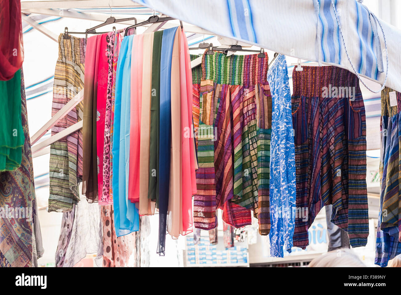 Shawl Women for sale at outdoor market. Italy Stock Photo