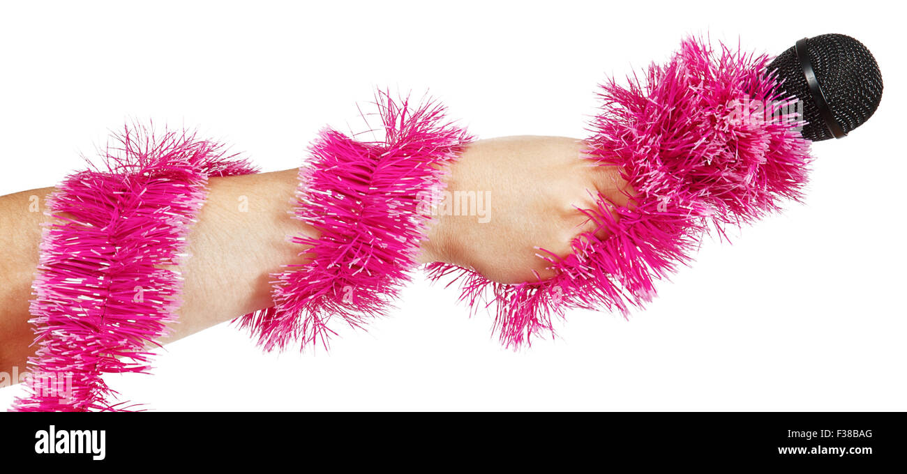 Female hand with pink garland holding a microphone isolated on white background Stock Photo