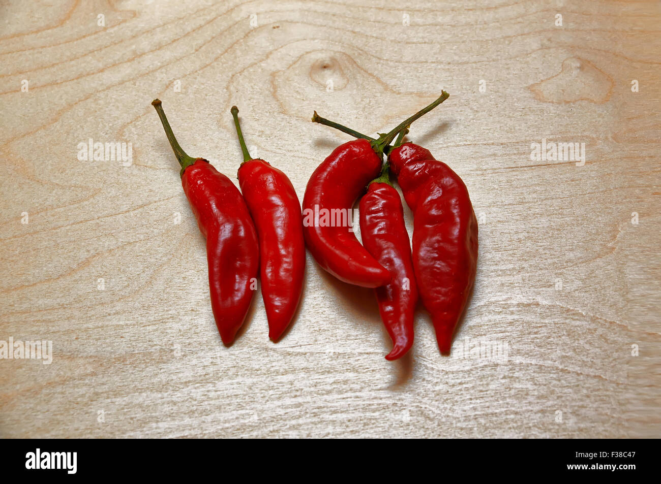 red chilli peppers on wooden table in rustic style Stock Photo - Alamy
