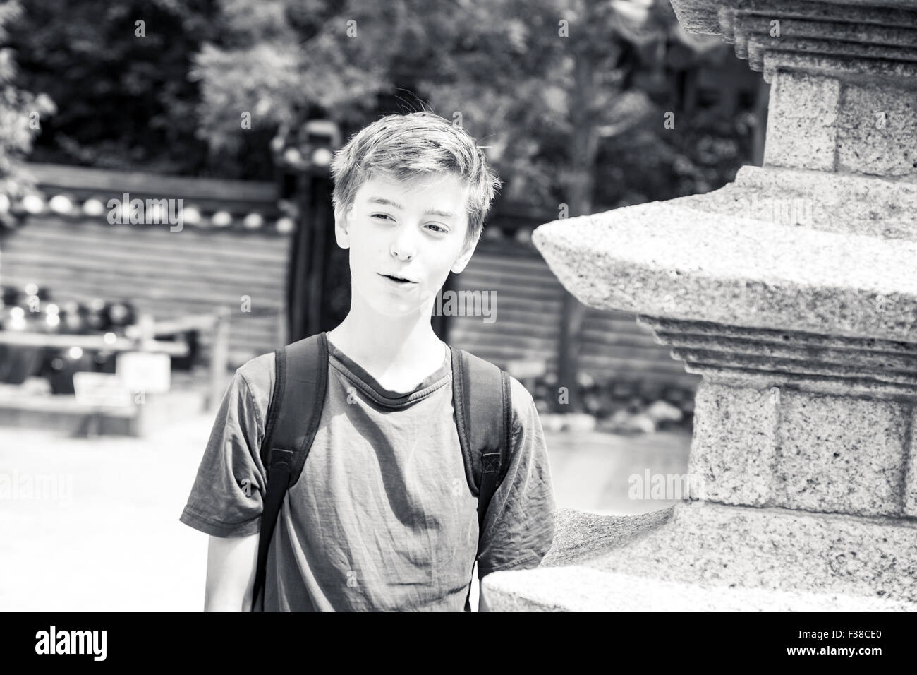 black and white portrait of a smiling teenage boy Stock Photo