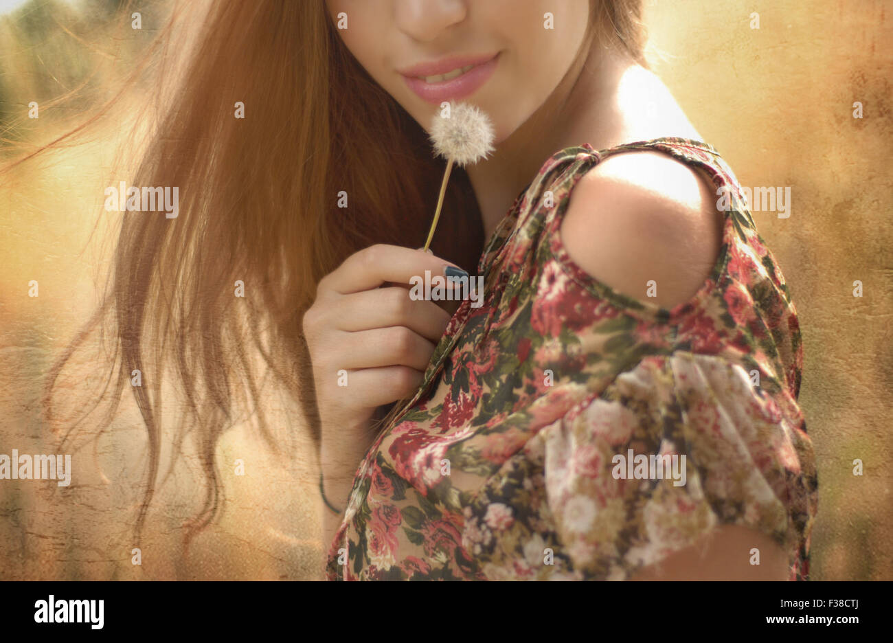 half face of a woman rose lips dandelion blonde hair Stock Photo