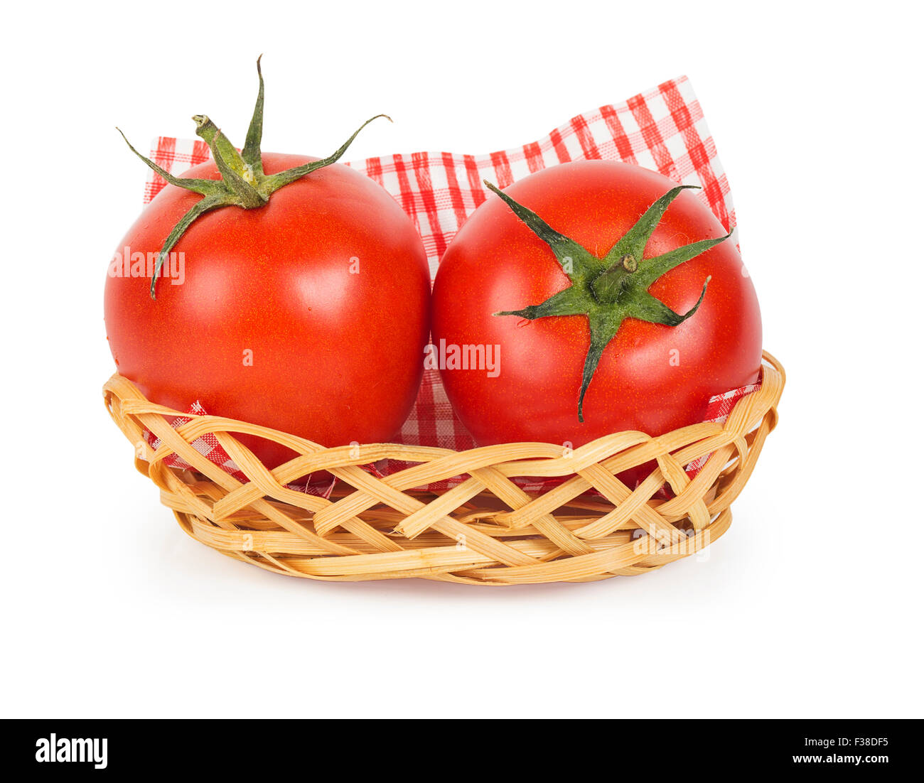 Two ripe juicy tomatoes in a basket isolated on white background Stock ...
