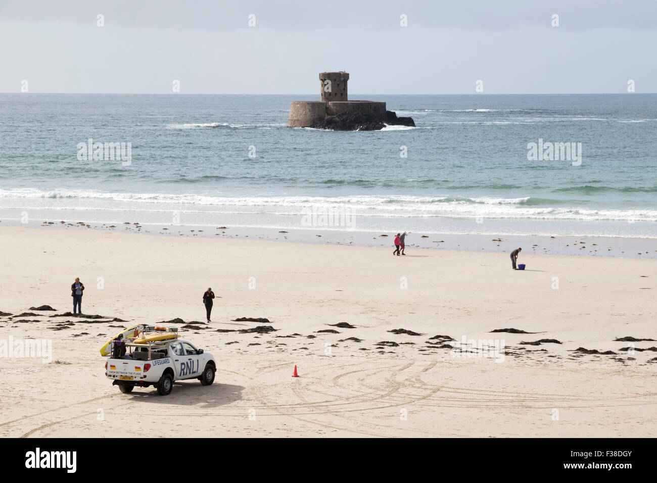 La Rocco Tower lying offshore in St Ouen's Bay on Jersey's west coast Stock Photo