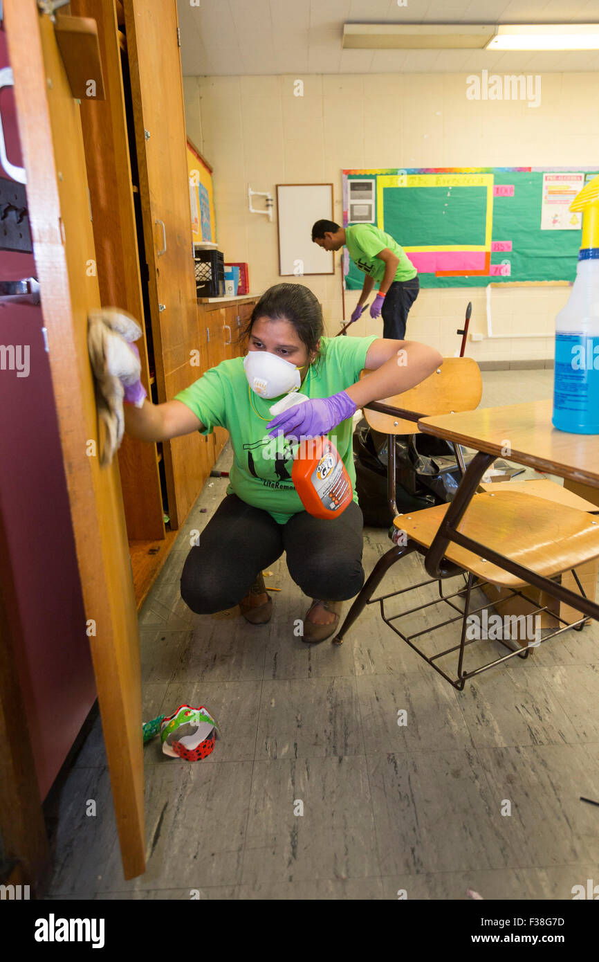 Detroit, Michigan - Volunteers clean and renovate classrooms at Osborn High School. Stock Photo