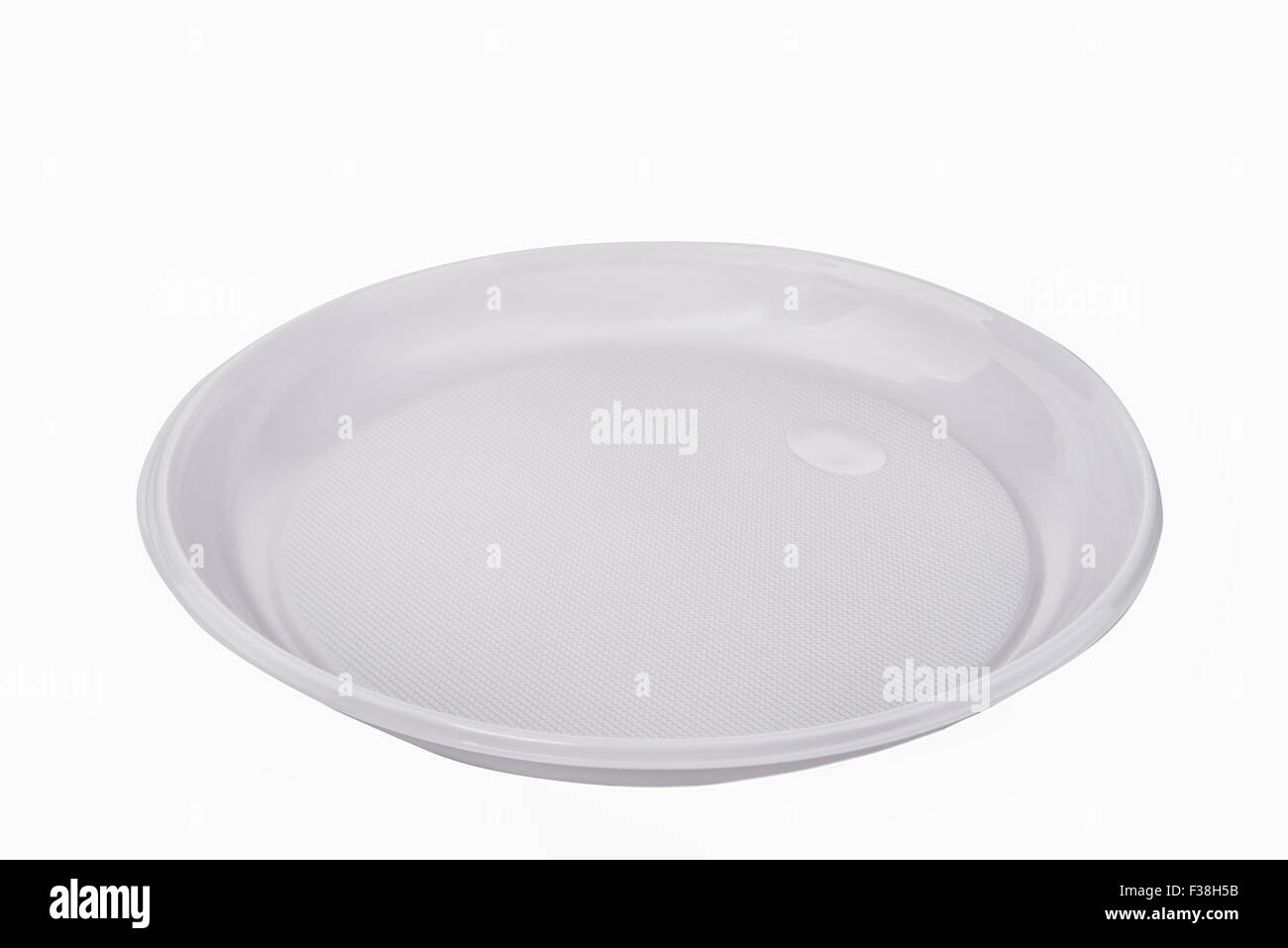 disposable plastic plate on a white background Stock Photo