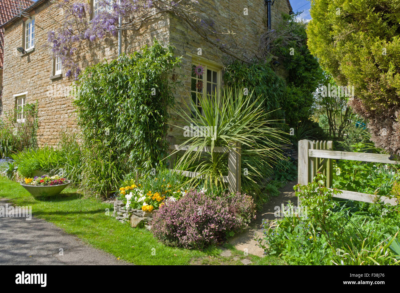 Open garden gate and house in the pretty Northamptonshire village of