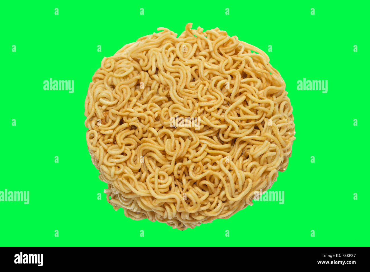 A circle of uncooked Ramen Noodles Isolated on green screen chroma key  background Stock Photo - Alamy