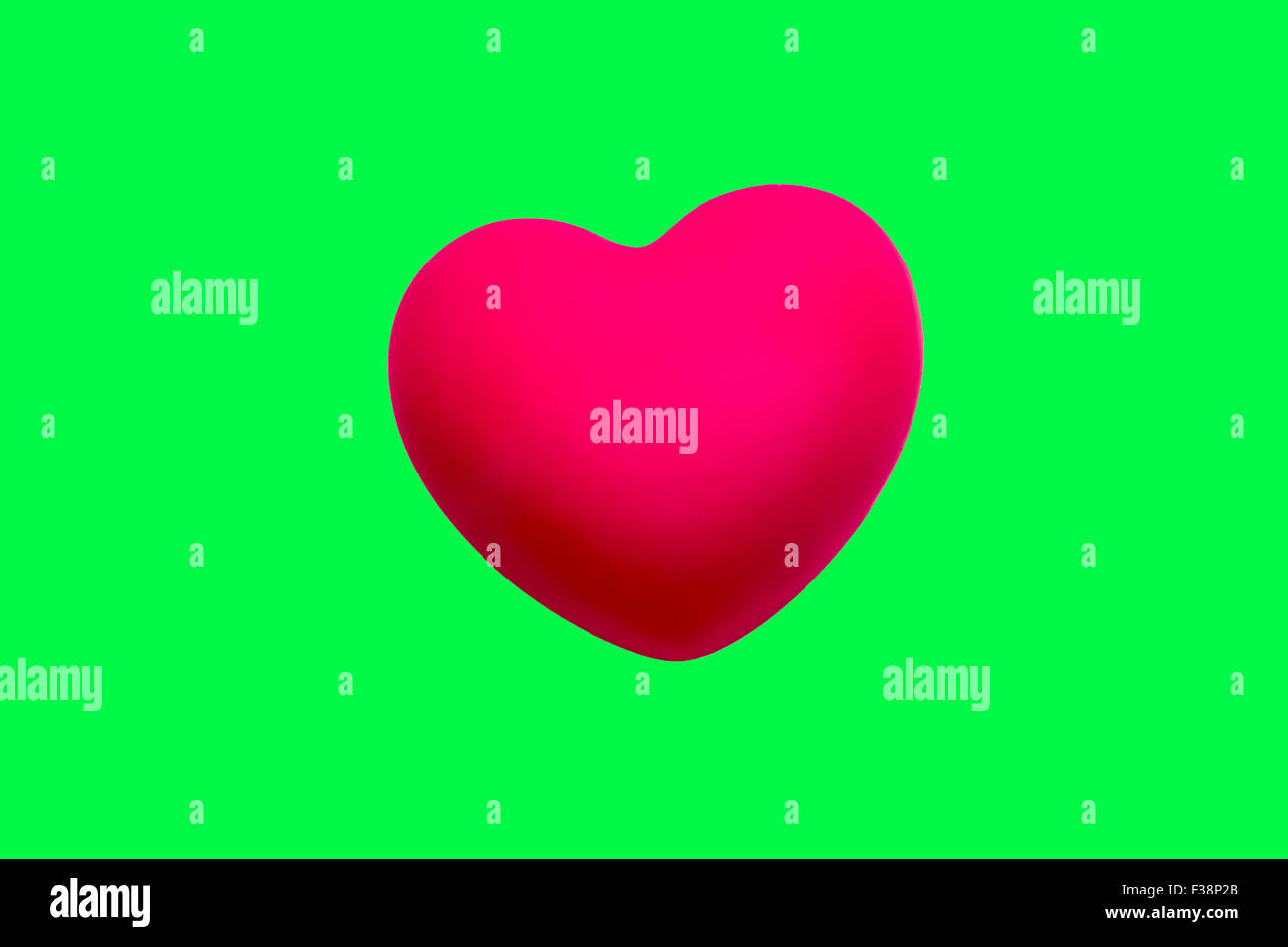 pink heart Isolated on green screen chroma key background. Stock Photo