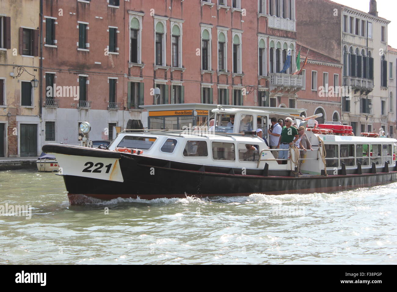A river taxi takes tourists around in Venice, Italy Stock Photo