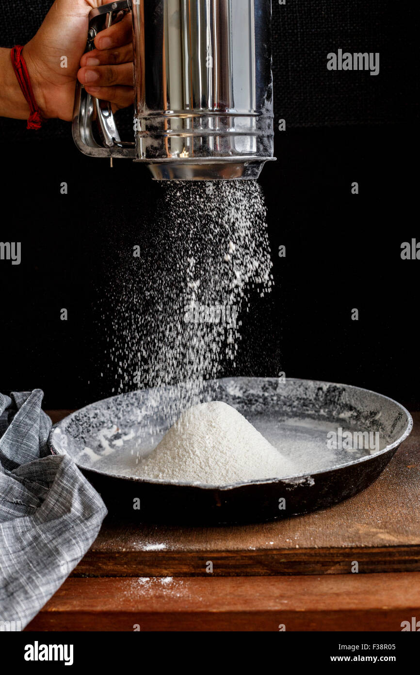 Sifting Flour, Ready for baking Stock Photo Alamy