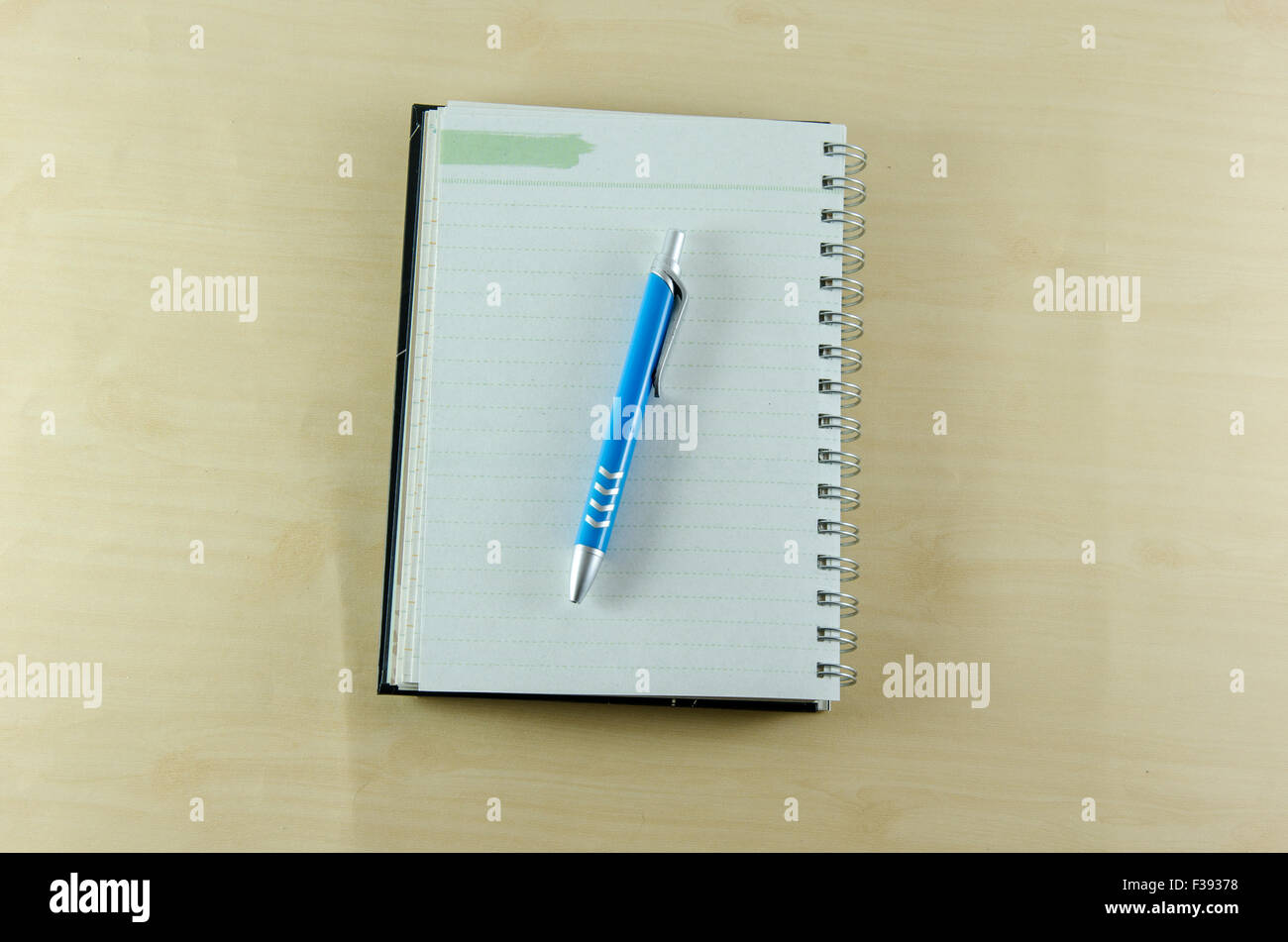 pen and book on the table Stock Photo - Alamy