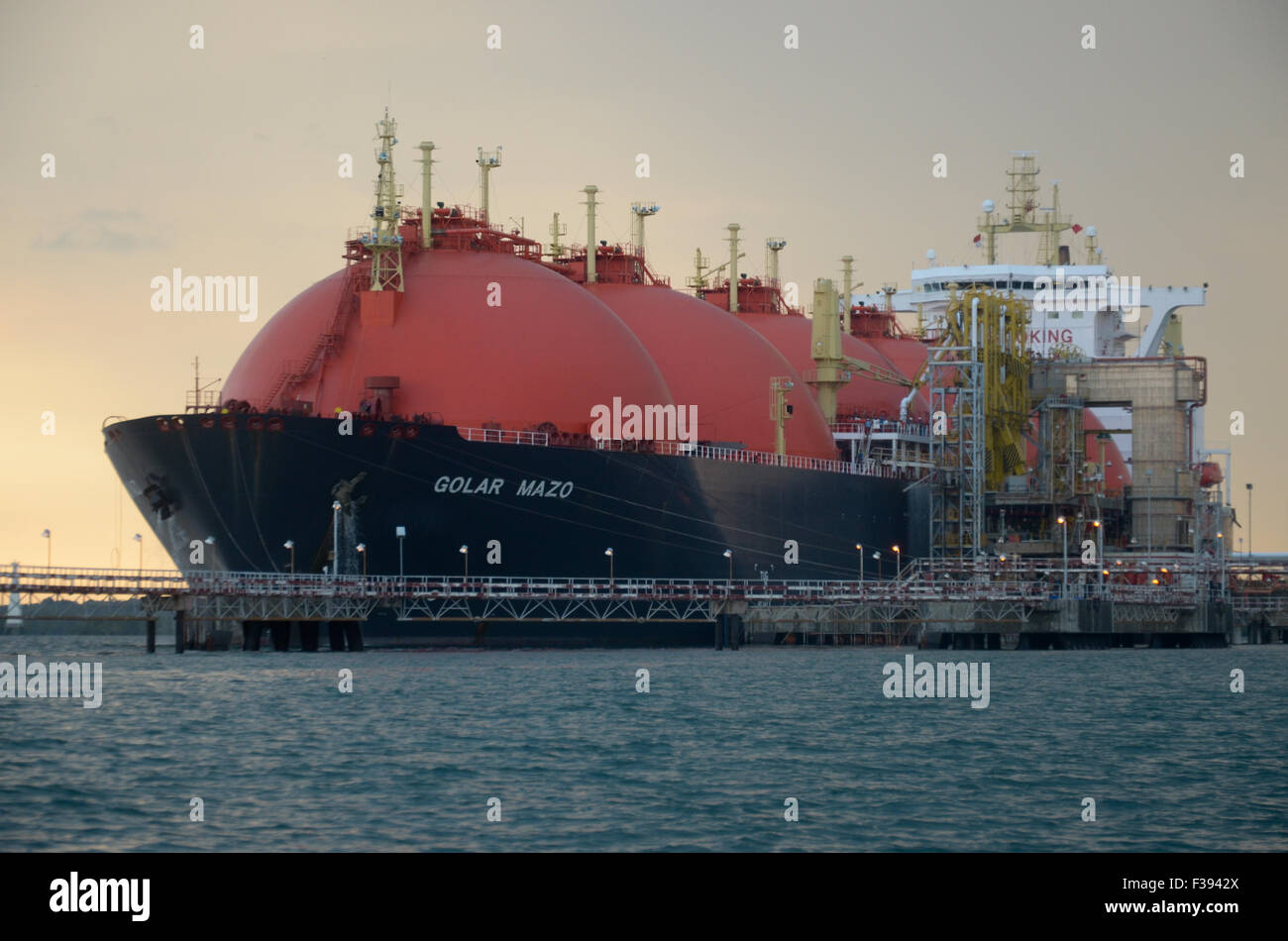 LNG tanker ship, docking in port  LNG terminal station, for up loading gas using loading arm pipe line Stock Photo