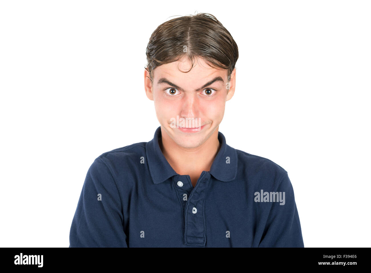 Angry geek teenage boy isolated in white Stock Photo