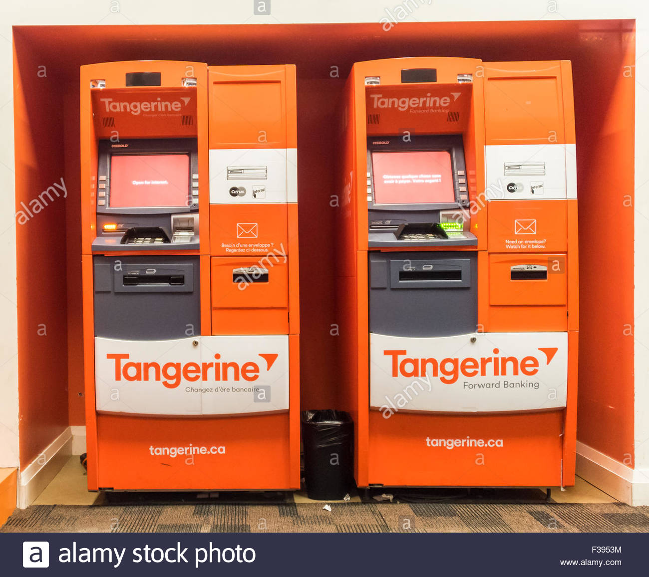 two automated banking machines in orange colour of tangerine tangerine bank