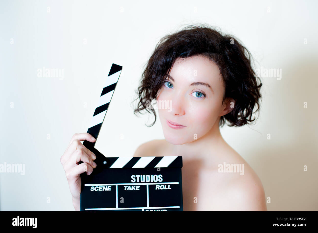 Young beautiful cinema actress with movie clapper board portrait Stock Photo